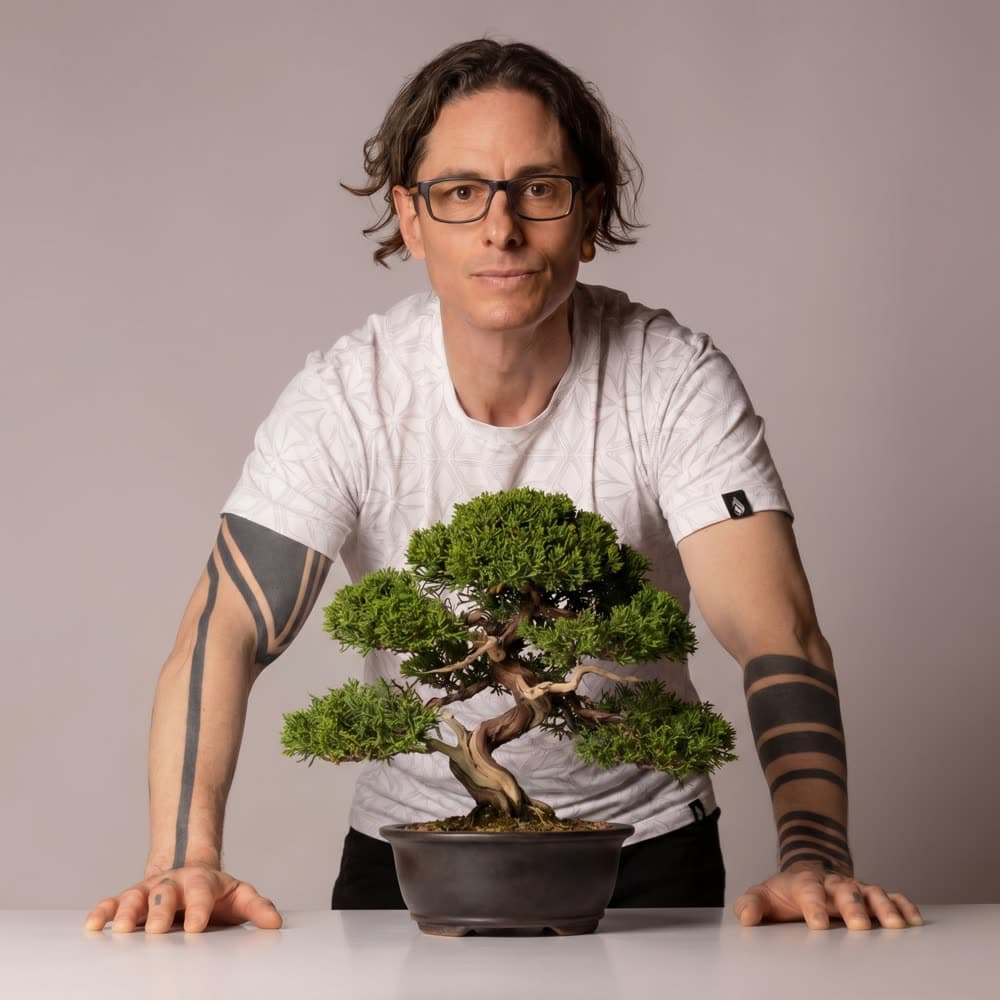 Jamie Barrett of Creative Pruning with a shaped bonsai tree
